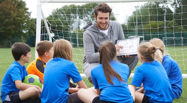 Soccer-coach-talking-to-young-players-.jpg